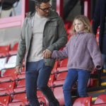 
              Wrexham co-owner, actor Ryan Reynolds arrives with his daughter, prior to the English FA Cup 4th round Soccer match between Wrexham and Sheffield United at The Racecourse Ground, in Wrexham, England, Sunday, Jan. 29, 2023. (Peter Byrne/PA via AP)
            