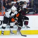 
              Philadelphia Flyers' Wade Allison, left, collides with Arizona Coyotes' Michael Carcone during the second period of an NHL hockey game, Thursday, Jan. 5, 2023, in Philadelphia. (AP Photo/Matt Slocum)
            