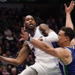 
              Washington Wizards forward Will Barton passes off the ball against Dallas Mavericks center Dwight Powell (7) during the first half of an NBA basketball game in Dallas, Tuesday, Jan. 24, 2023. (AP Photo/LM Otero)
            