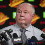 
              Vancouver Canucks head coach Bruce Boudreau pauses during a news conference after the team's NHL hockey game against the Edmonton Oilers on Saturday, Jan. 21, 2023, in Vancouver, British Columbia. (Darryl Dyck/The Canadian Press via AP)
            