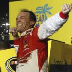 
              FILE - Kevin Harvick celebrates after winning the NASCAR Sprint Cup championship series auto race, Sunday, Nov. 16, 2014, in Homestead, Fla. Kevin Harvick said Thursday, Jan. 12, 2023, he will retire from NASCAR competition at the end of the 2023 season. (AP Photo/Terry Renna, File)
            