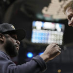 
              Boxer Floyd Mayweather Jr., left, talks with Dallas Mavericks owner Mark Cuban during the second half of an NBA basketball game between the Los Angeles Clippers and the Mavericks Tuesday, Jan. 10, 2023, in Los Angeles. (AP Photo/Mark J. Terrill)
            