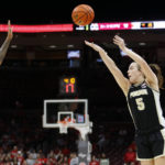 
              Purdue guard Cassidy Hardin, right, shoots in front of Ohio State guard Hevynne Bristow during the first half of an NCAA college basketball game in Columbus, Ohio, Sunday, Jan. 29, 2023. (AP Photo/Paul Vernon)
            
