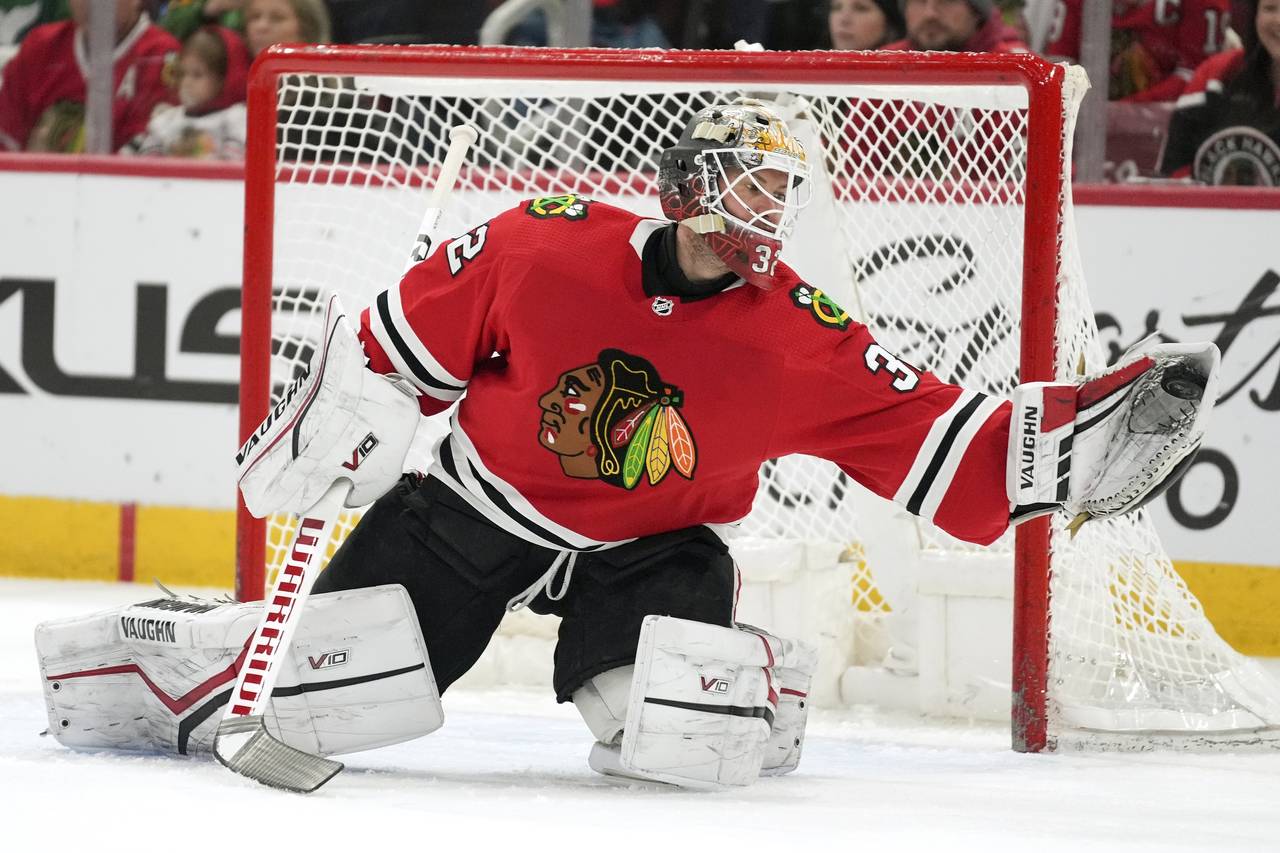 Chicago Blackhawks goaltender Alex Stalock (32) makes a save during the first period of an NHL hock...