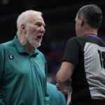 
              San Antonio Spurs head coach Gregg Popovich, left, talks with referee Matt Boland (18) during the second half of an NBA basketball game against the Los Angeles Clippers in Los Angeles, Thursday, Jan. 26, 2023. (AP Photo/Ashley Landis)
            
