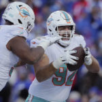 
              Miami Dolphins defensive tackle Zach Sieler (92) celebrates after his touchdown during the second half of an NFL wild-card playoff football game against the Buffalo Bills, Sunday, Jan. 15, 2023, in Orchard Park, N.Y. (AP Photo/Joshua Bessex)
            