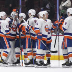 
              New York Islanders goalie Ilya Sorokin, second left, celebrates with teammates after the team's win over the Vancouver Canucks in an NHL hockey game Tuesday, Jan. 3, 2023, in Vancouver, British Columbia. (Darryl Dyck/The Canadian Press via AP)
            