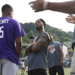 
              FILE - Buffalo Bills' Damar Hamlin, center, talks with Philadelphia Eagles' Miles Sanders during a celebrity kickball game hosted by NFL players at George Cupples Stadium in Pittsburgh, Saturday, June 25, 2022. Damar Hamlin plans to support young people through education and sports with the $8.6 million in GoFundMe donations that unexpectedly poured into his toy drive fundraiser after he suffered a cardiac arrest in the middle of a game last week. (AP photo via Post-Gazette)/Pittsburgh Post-Gazette via AP)
            