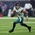 
              Jacksonville Jaguars quarterback Trevor Lawrence (16) looks to pass against the Houston Texans during the second half of an NFL football game in Houston, Sunday, Jan. 1, 2023. (AP Photo/David J. Phillip)
            