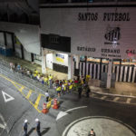 
              Soccer fans wait outside the Vila Belmiro stadium for the doors to open for the funeral of the late Brazilian soccer star Pele, in Santos, Brazil, Monday, Jan. 2, 2023. (AP Photo/Matias Delacroix)
            