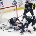 
              Colorado Avalanche center Evan Rodrigues (9) tries to tap in a goal but Seattle Kraken goaltender Philipp Grubauer (31) makes the block during the first period of an NHL hockey game Saturday, Jan. 21, 2023, in Seattle. (AP Photo/Lindsey Wasson)
            