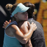 
              Magda Linette, left, of Poland embraces Caroline Garcia of France following their fourth round match at the Australian Open tennis championship in Melbourne, Australia, Monday, Jan. 23, 2023. (AP Photo/Aaron Favila)
            