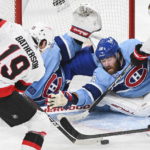 
              Ottawa Senators Drake Batherson (19) moves in on Montreal Canadiens' goaltender Jake Allen as Canadiens' David Savard attempts to block the shot during the second period of an NHL hockey game, Tuesday, Jan. 31, 2023 in Montreal. (Graham Hughes/The Canadian Press via AP)
            