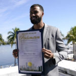 
              Miami Marlins pitcher Sandy Alcantara, the 2022 National League Cy Young winner, holds a proclamation after being presented with the key to the City of Miami by Miami Mayor Francis Suarez, at Miami City Hall, Tuesday, Jan. 10, 2023, in Miami. (AP Photo/Lynne Sladky)
            