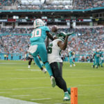 
              New York Jets linebacker Quincy Williams (56) defends Miami Dolphins wide receiver Tyreek Hill (10) as he can't hold onto a pass during the second half of an NFL football game, Sunday, Jan. 8, 2023, in Miami Gardens, Fla. (AP Photo/Lynne Sladky)
            