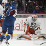 
              Anaheim Ducks goaltender John Gibson, right, makes a glove-save of a shot by Colorado Avalanche center Evan Rodrigues in the second period of an NHL hockey game Thursday, Jan. 26, 2023, in Denver. (AP Photo/David Zalubowski)
            