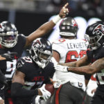 
              Atlanta Falcons safety Richie Grant (27) recovers a fumble during the first half of an NFL football game against the Tampa Bay Buccaneers, Sunday, Jan. 8, 2023, in Atlanta. (AP Photo/Hakim Wright Sr.)
            