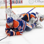 
              New York Islanders' goalie Ilya Sorokin (30) is crashed into by Edmonton Oilers' Leon Draisaitl (29) during second-period NHL hockey game action in Edmonton, Alberta, Thursday, Jan. 5, 2023. (Jason Franson/The Canadian Press via AP)
            