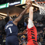 
              Minnesota Timberwolves guard Anthony Edwards (1) fouls Portland Trail Blazers center Jusuf Nurkic during the first half of an NBA basketball game, Wednesday, Jan. 4, 2023, in Minneapolis. (AP Photo/Craig Lassig)
            