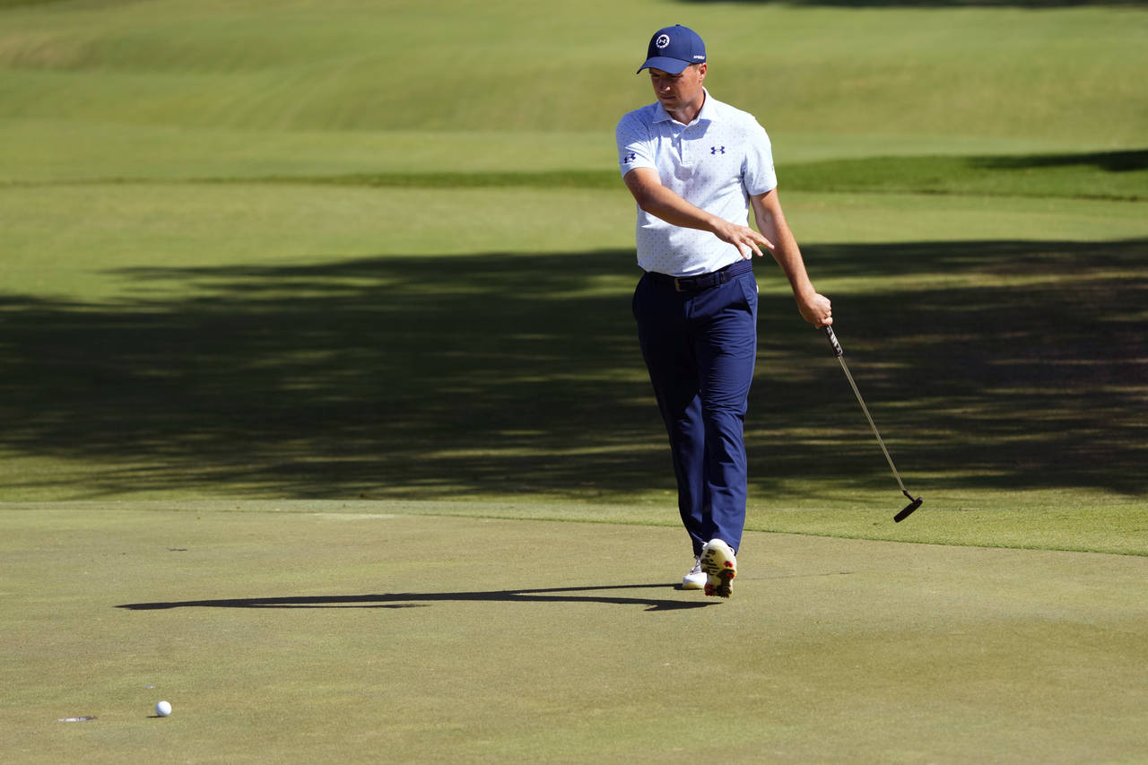 Jordan Spieth watches his birdie putt miss the cup on the fifth green during the second round of th...