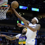 
              Washington Wizards guard Bradley Beal (3) shoots against New Orleans Pelicans forward Brandon Ingram (14) in the first half of an NBA basketball game in New Orleans, Saturday, Jan. 28, 2023. (AP Photo/Matthew Hinton)
            