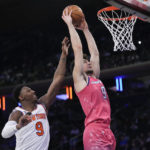 
              Washington Wizards forward Deni Avdija dunks past New York Knicks guard RJ Barrett during the second half of an NBA basketball game Wednesday, Jan. 18, 2023, at Madison Square Garden in New York. The Wizards won 116-105. (AP Photo/Mary Altaffer)
            