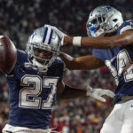 
              Dallas Cowboys safety Jayron Kearse (27) celebrates with safety Israel Mukuamu after intercepting the ball against Tampa Bay Buccaneers quarterback Tom Brady during the first half of an NFL wild-card football game, Monday, Jan. 16, 2023, in Tampa, Fla. (AP Photo/Chris O'Meara)
            