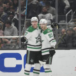
              Dallas Stars defenseman Esa Lindell (23) celebrates with center Wyatt Johnston (53) after scoring during the first period of an NHL hockey game against the Los Angeles Kings Thursday, Jan. 19, 2023, in Los Angeles. (AP Photo/Ashley Landis)
            
