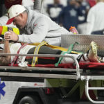
              Tampa Bay Buccaneers wide receiver Russell Gage is taken off the filed after being injured against the Dallas Cowboys during the second half of an NFL wild-card football game, Monday, Jan. 16, 2023, in Tampa, Fla. (AP Photo/Chris Carlson)
            