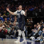 
              Dallas Mavericks guard Luka Doncic (77) reacts after watching a replay during the second half of an NBA basketball game against the Los Angeles Clippers in Dallas, Sunday, Jan. 22, 2023. (AP Photo/LM Otero)
            