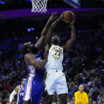 
              Indiana Pacers' Aaron Nesmith (23) goes up for a shot against Philadelphia 76ers' James Harden (1) during the first half of an NBA basketball game, Wednesday, Jan. 4, 2023, in Philadelphia. (AP Photo/Matt Slocum)
            