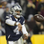 
              Dallas Cowboys quarterback Dak Prescott (4) throws the ball away while in the end zone during the second half an NFL football game against the Washington Commanders, Sunday, Jan. 8, 2023, in Landover, Md. (AP Photo/Alex Brandon)
            