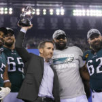
              Philadelphia Eagles general manager Howie Roseman, center, stands with defensive end Brandon Graham (55) offensive tackle Lane Johnson (65), defensive tackle Fletcher Cox, and center Jason Kelce (62) after the NFC Championship NFL football game between the Philadelphia Eagles and the San Francisco 49ers on Sunday, Jan. 29, 2023, in Philadelphia. The Eagles won 31-7. (AP Photo/Matt Slocum)
            