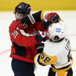 
              Washington Capitals right wing Anthony Mantha (39) and Pittsburgh Penguins defenseman Kris Letang (58) scuffle during the third period of an NHL hockey game, Thursday, Jan. 26, 2023, in Washington. (AP Photo/Nick Wass)
            