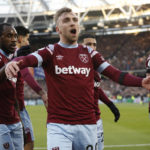 
              West Ham's Jarrod Bowen, center, celebrates after scoring his side's opening goal during the English Premier League soccer match between West Ham United and Everton at the London Stadium in London, Saturday, Jan. 21, 2023. (AP Photo/Steve Luciano)
            