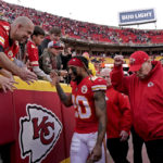 
              Kansas City Chiefs safety Justin Reid (20) and head coach Andy Reid celebrate with fans after an NFL football game against the Denver Broncos Sunday, Jan. 1, 2023, in Kansas City, Mo. (AP Photo/Charlie Riedel)
            