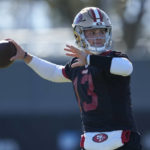 
              San Francisco 49ers quarterback Brock Purdy (13) passes during an NFL football practice in Santa Clara, Calif., Thursday, Jan. 26, 2023. The 49ers are scheduled to play the Philadelphia Eagles Sunday in the NFC championship game. (AP Photo/Jeff Chiu)
            