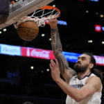 
              Memphis Grizzlies center Steven Adams (4) dunks during the first half of an NBA basketball game against the Los Angeles Lakers in Los Angeles, Friday, Jan. 20, 2023. (AP Photo/Ashley Landis)
            