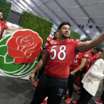 
              Utah defensive tackle Junior Tafuna (58) takes a selfie with teammates in from the of the logo during media day ahead of the Rose Bowl NCAA college football game Saturday, Dec. 31, 2022, in Pasadena, Calif. (AP Photo/Marcio Jose Sanchez)
            