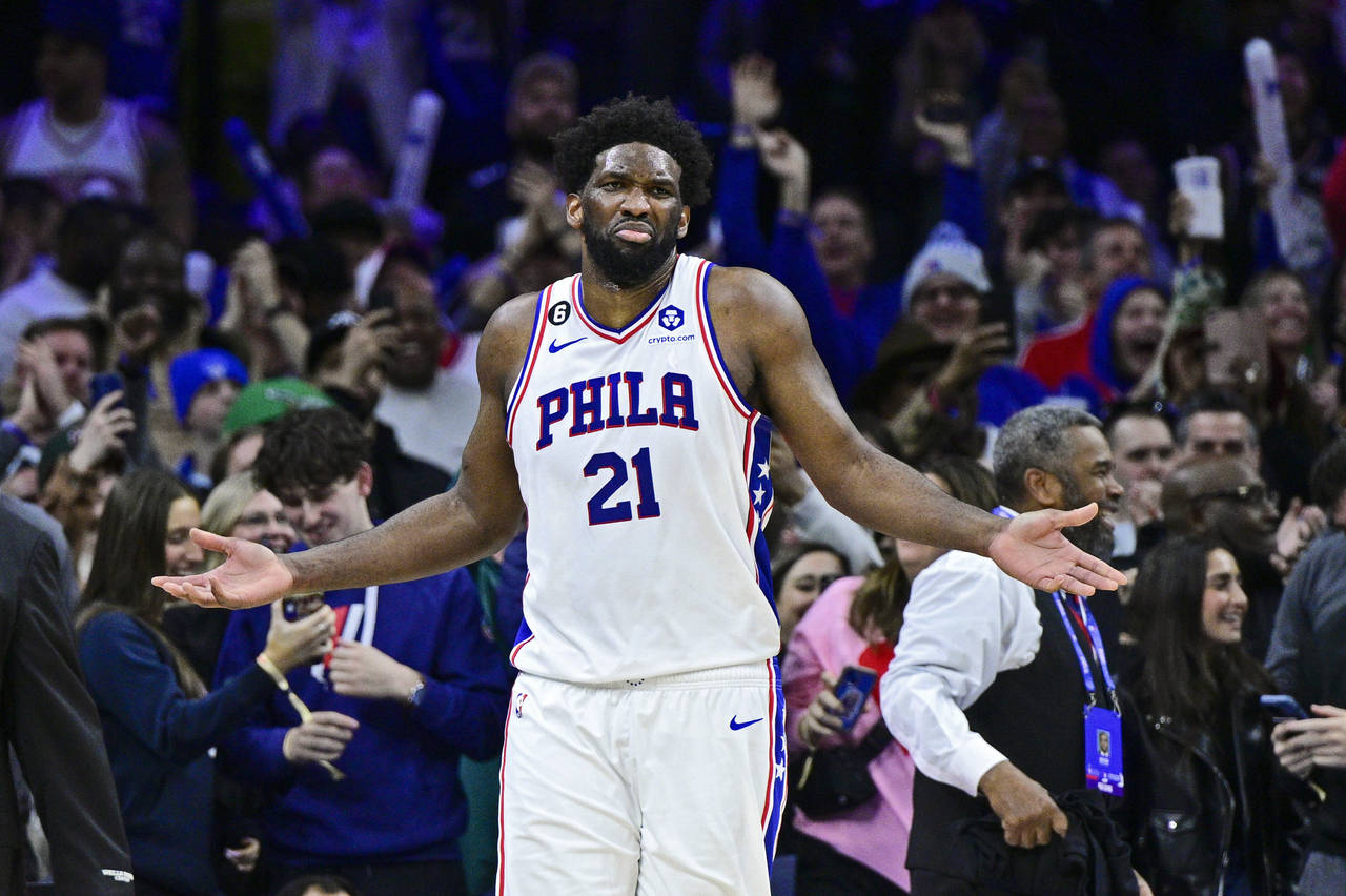 Philadelphia 76ers' Joel Embiid reacts after a play duining the second half of an NBA basketball ga...