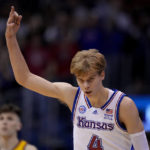 
              Kansas guard Gradey Dick celebrates after making a three-point shot during the second half of an NCAA college basketball game against Iowa State Saturday, Jan. 14, 2023, in Lawrence, Kan. Kansas won 62-60 (AP Photo/Charlie Riedel)
            