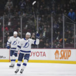 
              Tampa Bay Lightning's Steven Stamkos raises his stick to the crowd while receiving a standing ovation after he scored against the Vancouver Canucks, his 500th career goal, during the first period of an NHL hockey game Wednesday, Jan. 18, 2023, in Vancouver, British Columbia. (Darryl Dyck/The Canadian Press via AP)
            