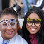 
              Denette King and Nia Boyd celebrate 2023 on Colorado Boulevard during the 134th Rose Parade in Pasadena, Calif, Monday, Jan. 2, 2023. (Dean Musgrove/The Orange County Register via AP)
            