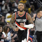 
              Portland Trail Blazers guard Damian Lillard (0) reacts during the second quarter of an NBA basketball game against the Indiana Pacers, Friday, Jan. 6, 2023, in Indianapolis. (AP Photo/Marc Lebryk)
            