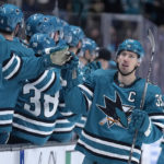 
              San Jose Sharks center Logan Couture (39) is congratulated by teammates after his goal against the Boston Bruins during the first period of an NHL hockey game Saturday, Jan. 7, 2023, in San Jose, Calif. (AP Photo/Tony Avelar)
            