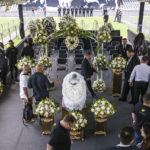 
              The coffin with the remains of Brazilian soccer great Pele lies on display on the pitch of the Vila Belmiro stadium in Santos, Brazil, Monday, Jan. 2, 2023. (AP Photo/Matias Delacroix)
            