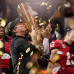 
              Georgia head coach Kirby Smart kisses the championship trophy after the national championship NCAA College Football Playoff game against TCU, Monday, Jan. 9, 2023, in Inglewood, Calif. Georgia won 65-7. (AP Photo/Ashley Landis)
            