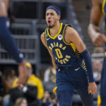 
              Indiana Pacers guard Tyrese Haliburton (0) reacts after scoring during the first half of an NBA basketball game against the Toronto Raptors in Indianapolis, Monday, Jan. 2, 2023. (AP Photo/Doug McSchooler)
            