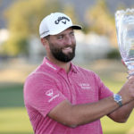 
              Jon Rahm hold the winner's trophy after the American Express golf tournament on the Pete Dye Stadium Course at PGA West Sunday, Jan. 22, 2023, in La Quinta, Calif. (AP Photo/Mark J. Terrill)
            