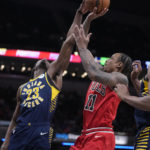 
              Indiana Pacers forward Aaron Nesmith (23) blocks the shot of Chicago Bulls forward DeMar DeRozan (11) during the second half of an NBA basketball game in Indianapolis, Tuesday, Jan. 24, 2023. The Pacers defeated the Bulls 116-110. (AP Photo/Michael Conroy)
            